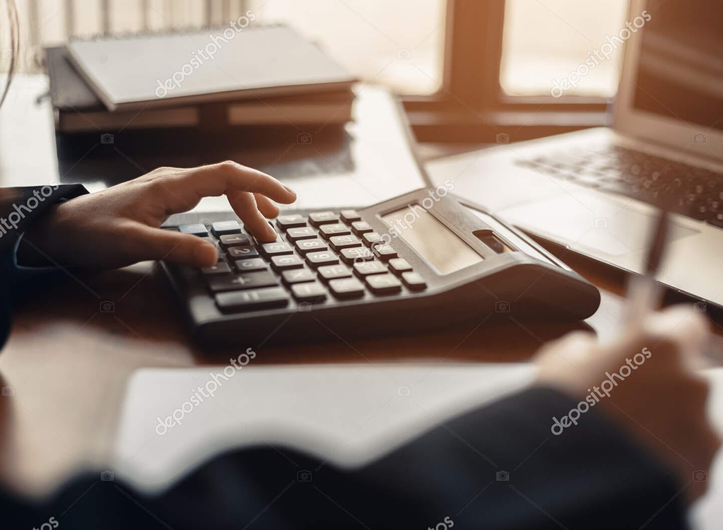 Business Woman Using Calculator